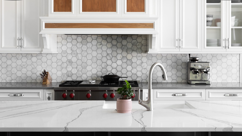 A bold kitchen backsplash with more subtle countertops