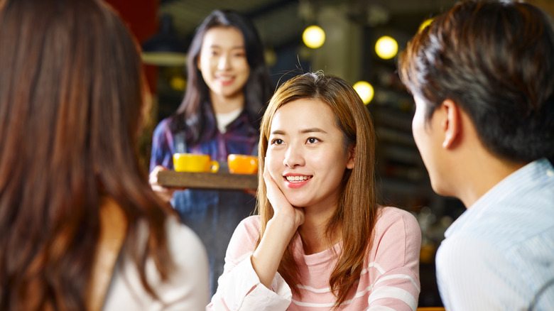 people eating at a diner in hong kong