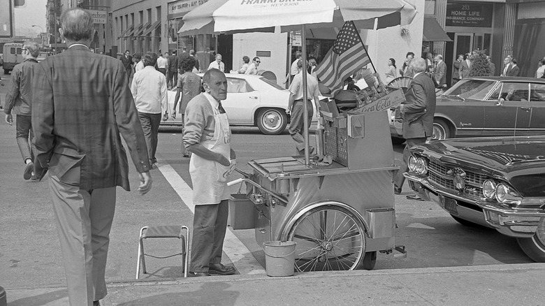 A vintage picture of a hot dog seller
