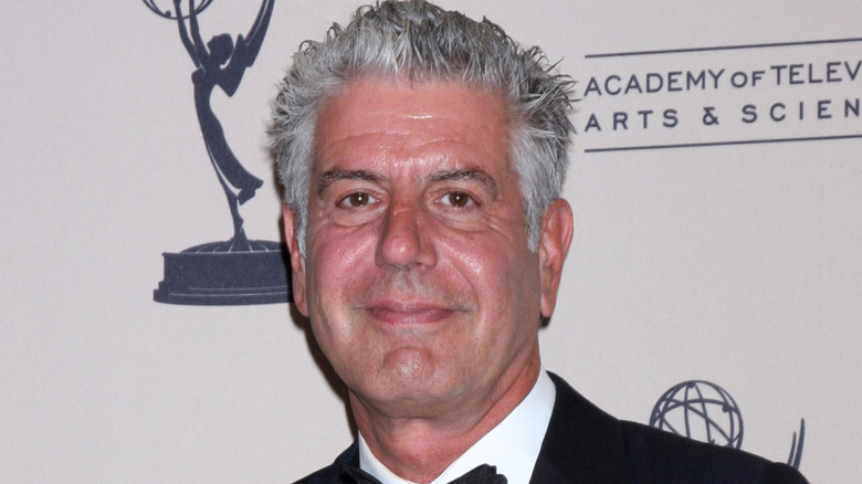 Anthony Bourdain smiling at an event.