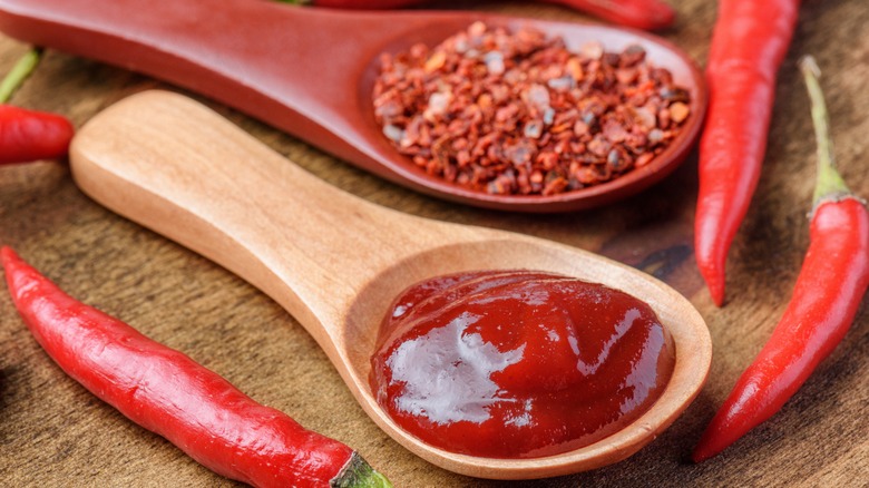 Chili flakes, hot sauce, and chilis.