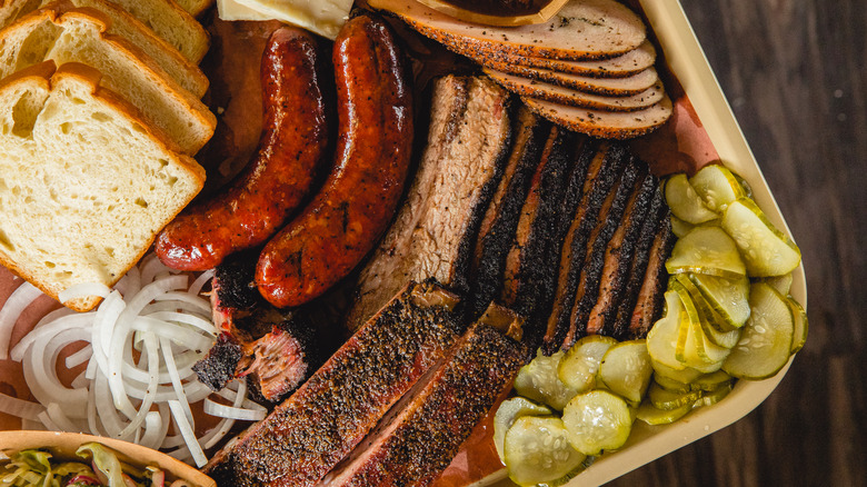 Texas barbecue tray with brisket, sausage, pickles, and more