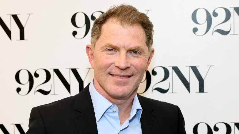 Bobby Flay smiling on red carpet