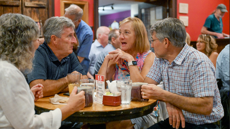 Group of people smiling at Caffe Lena