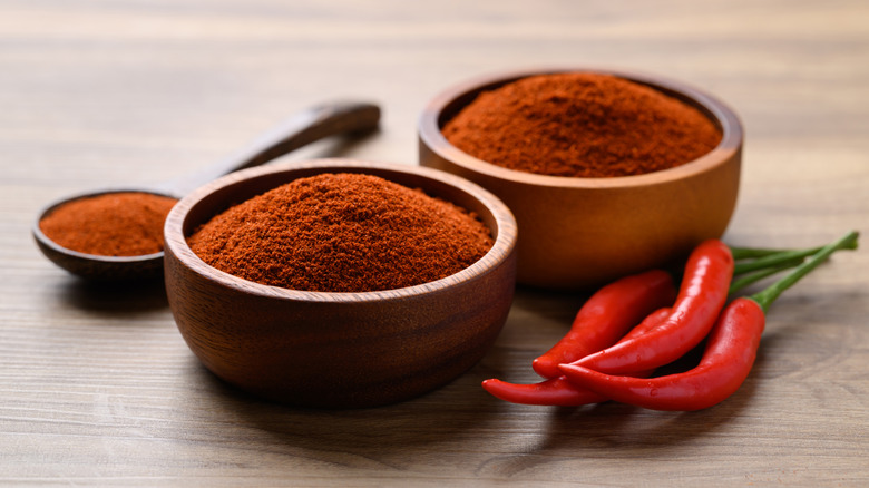 A bowl of red chili powder.