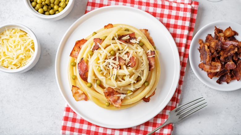 Bowl of carbonara pasta with peas