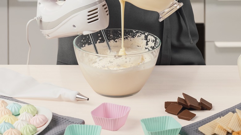 Making whipped cream in glass bowl