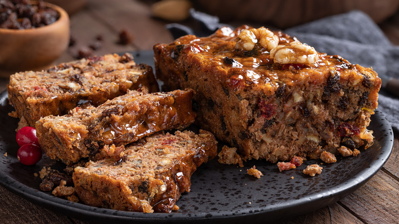 Slices and loaf of fruitcake
