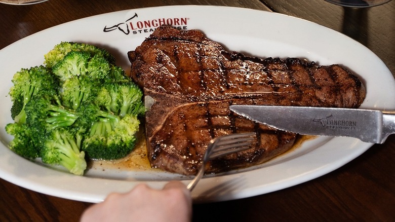 A LongHorn Steakhouse dinner with steak and broccoli