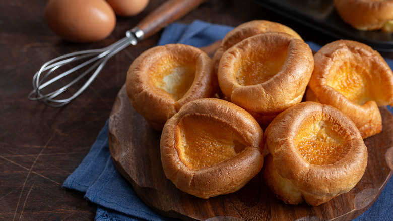 Yorkshire puddings on a wooden background.