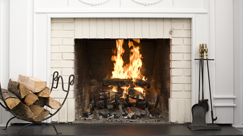 Logs burning away in a fireplace.