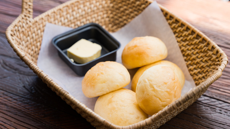 Dinner rolls in basket with butter