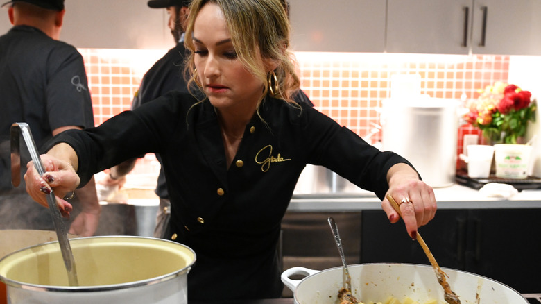 Giada De Laurentiis cooking at stove 