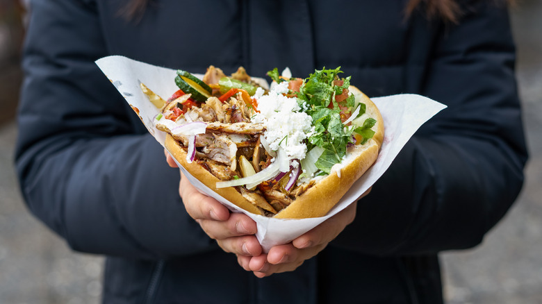 Person holding german doner kebab