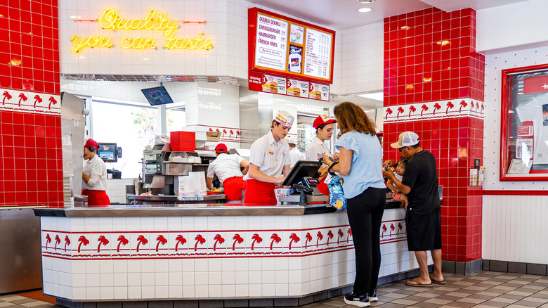 People ordering food at In-N-Out Burger.