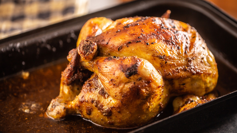 Roast chicken in pan.