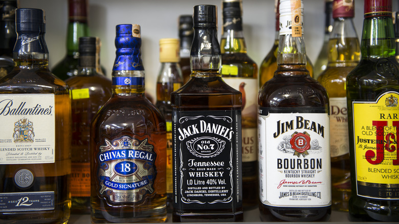 Bottles of various brands of whiskey