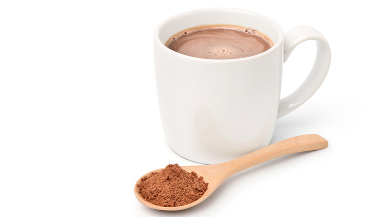 A cup of hot chocolate with malted chocolate milk powder.