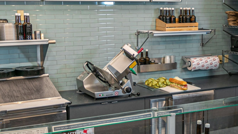 A slicer sits behind the counter at a Jersey Mike's location