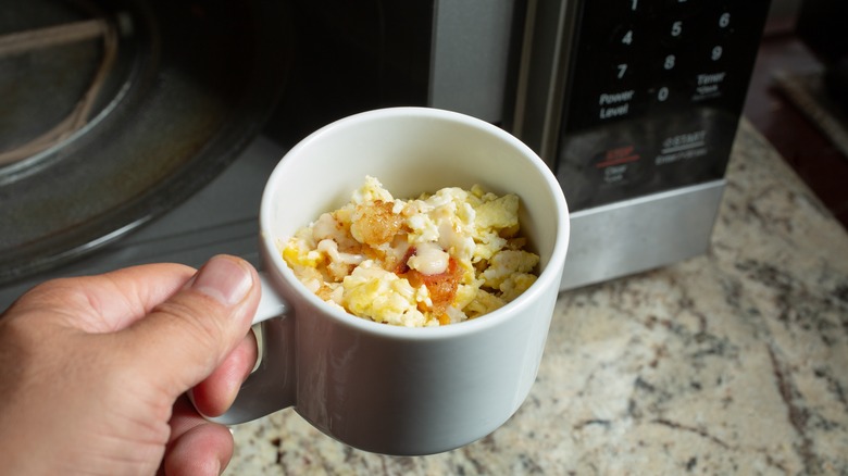 bowl of eggs pictured next to microwave