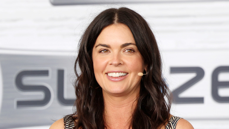 Katie Lee smiling at an event