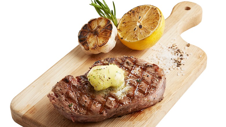 Steak with lemon, butter, garlic, and rosemary