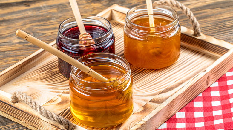 Apricot jelly, raspberry jam, and apple jelly