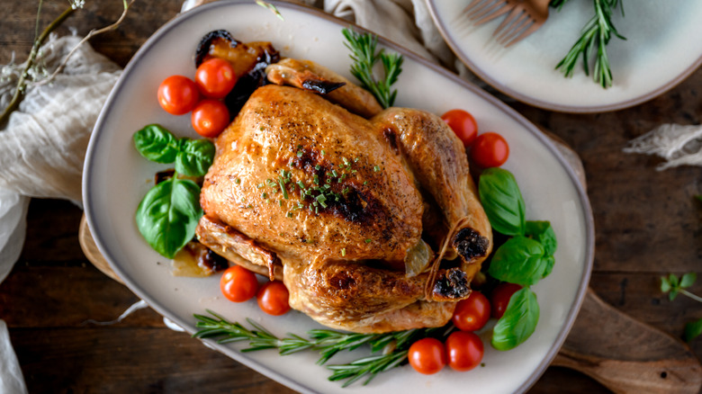 roast chicken displayed on dinner table