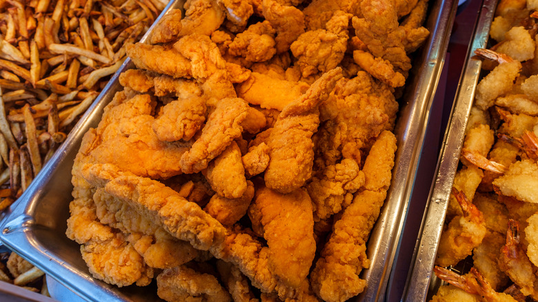 chicken tenders displayed on warming tray