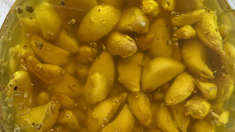 Garlic confit in the process of cooking