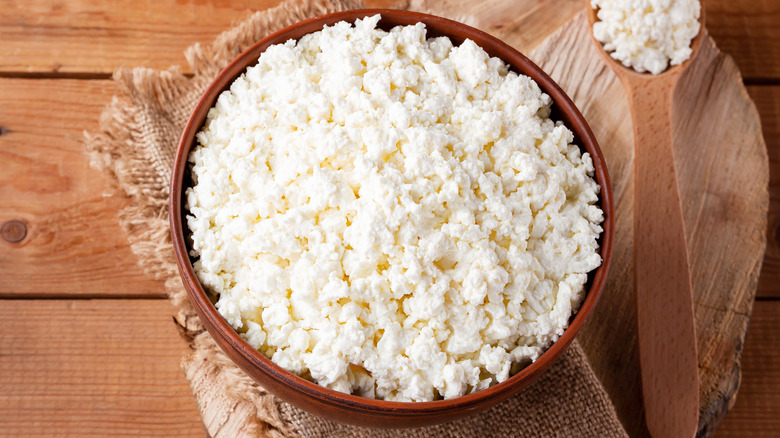 bowl of cottage cheese near spoon