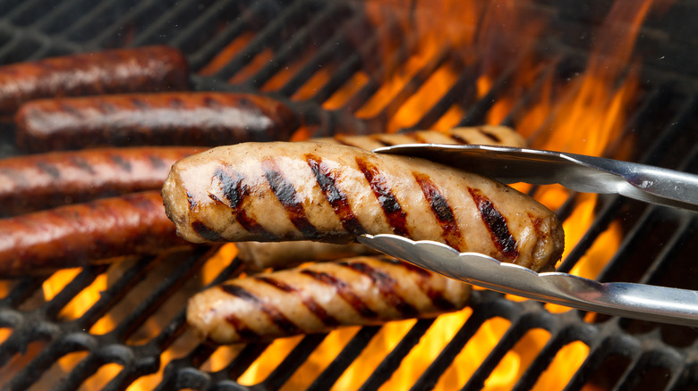 Bratwurst sausages cooking on the grill