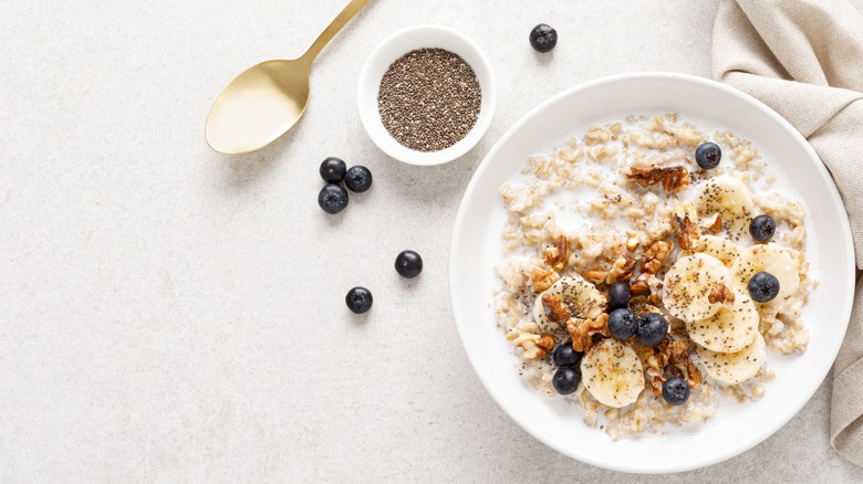 A bow of oatmeal with nuts and fruits