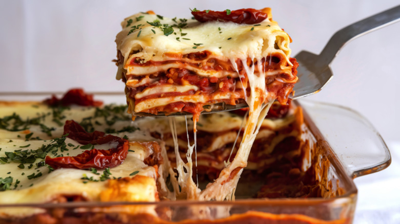 Lasagna slice lifted from a baking dish