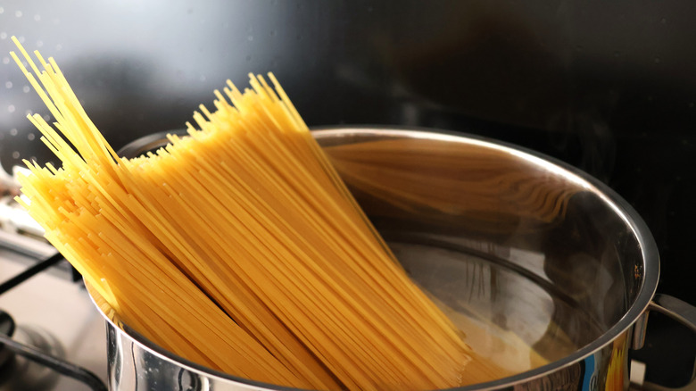 Spaghetti boiling in a pot