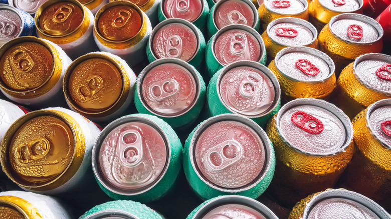 Colorful cans of unopened beer