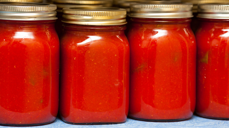 jars of unlabeled marinara sauce