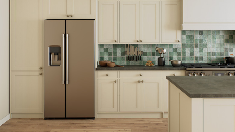 A refrigerator in a clean kitchen.
