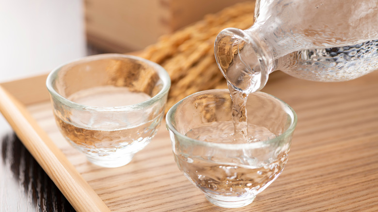 sake pouring from bottle into glass