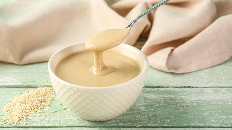 Bowl and spoonful of tahini