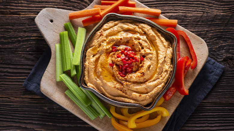 red pepper hummus served over vegetable charcuterie board