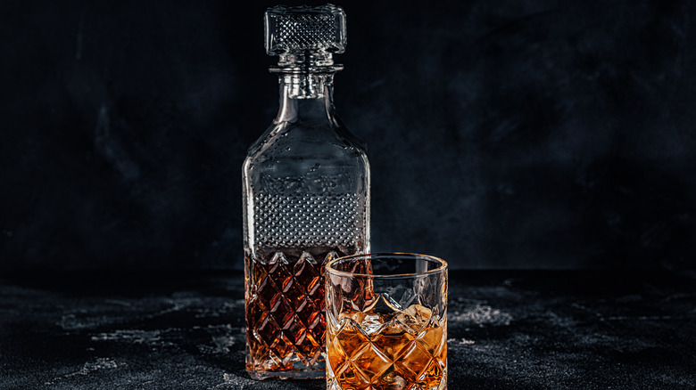 Whiskey decanter and glass of whiskey
