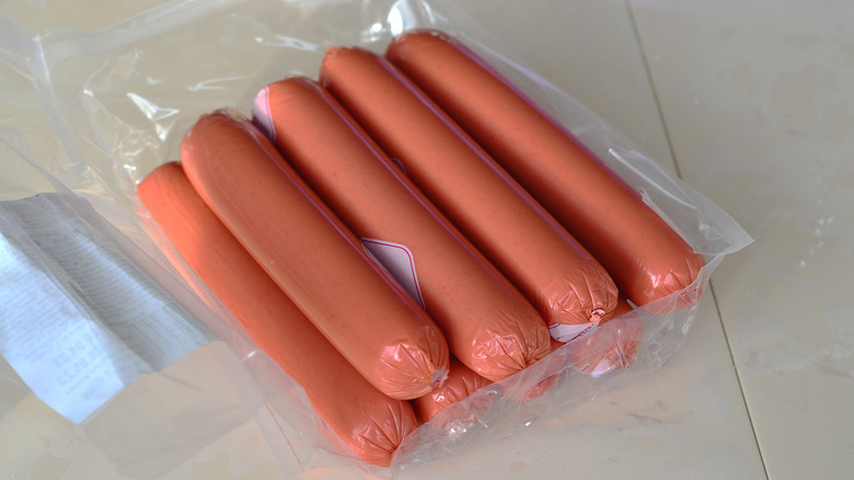 package of hot dogs on tile
