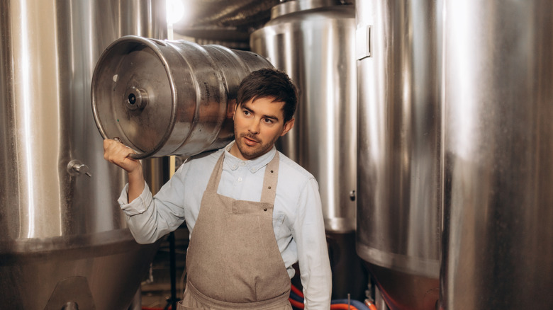 Brewer with full-sized keg