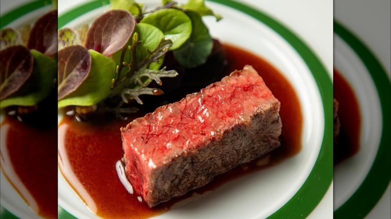 Beef and Daube Glacé and Beef Jus with Spring Greens from Emeril's.