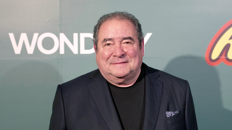 Emeril Lagasse smiling at an event.
