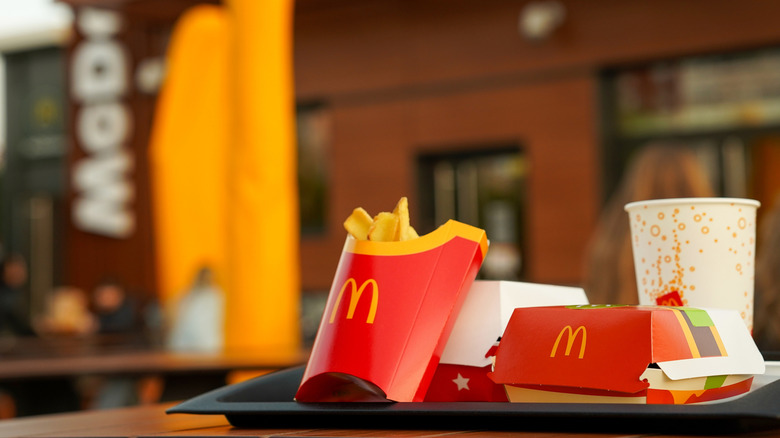 A staged McDonald's meal with sandwich, fries, and drink