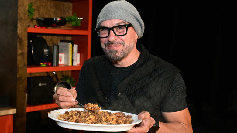Symon poses at the Food Network New York City Wine and Food Festival, 2023.
