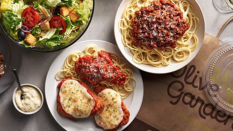 Olive Garden food with a side of cheese.