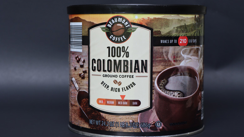 Container of Beaumont Coffee before a dark background